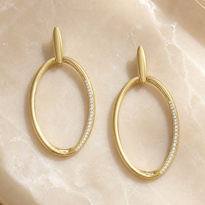 E1491 - 14K Yellow Gold Diamond Oval Hoop Earrings