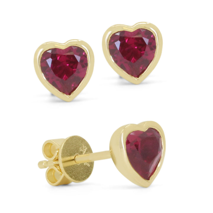 Beautiful Hand Crafted 14K Yellow Gold 5X10MM Created Ruby And Diamond Essentials Collection Stud Earrings With A Push Back Closure