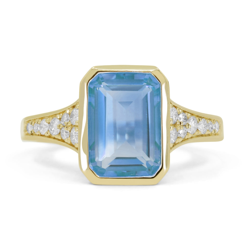 Beautiful Hand Crafted 14K Yellow Gold 7X10MM Blue Topaz And Diamond Essentials Collection Ring